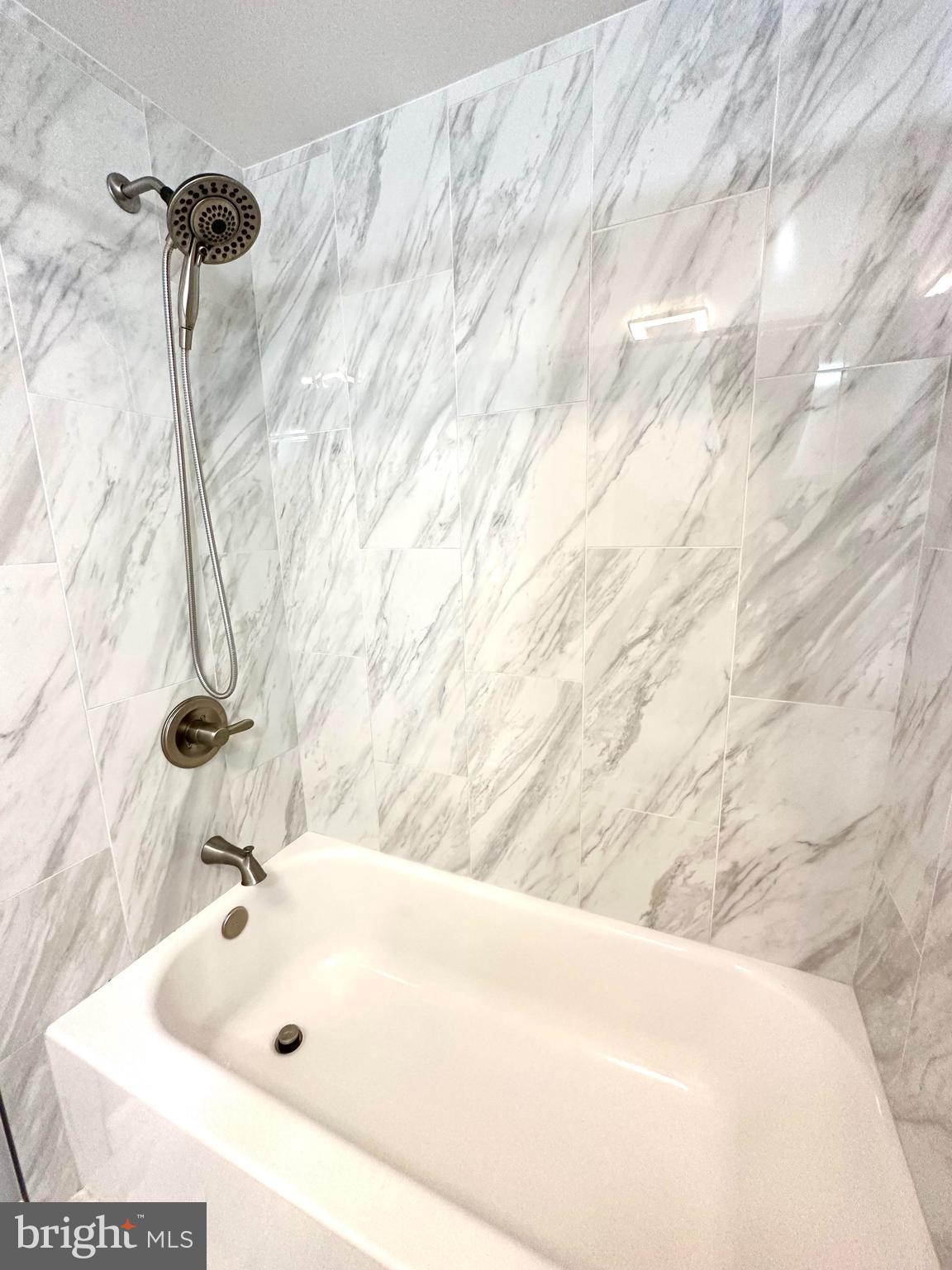 8301 Windfall Road Springfield, VA 22153 - Photo 10 of 22 a bathroom with a bathtub