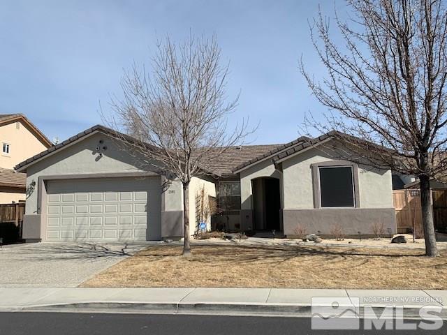 2581 Spring Flower Drive Reno, NV 89521 - Photo 1 of 14 a front view of a house with garden