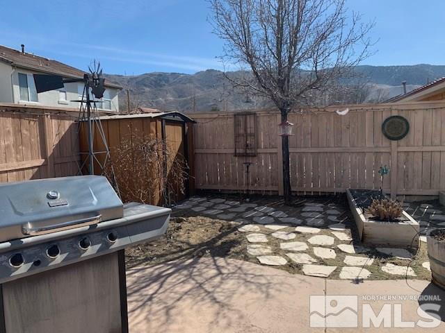 2581 Spring Flower Drive Reno, NV 89521 - Photo 12 of 14 a view of a backyard with couches chair and wooden floor