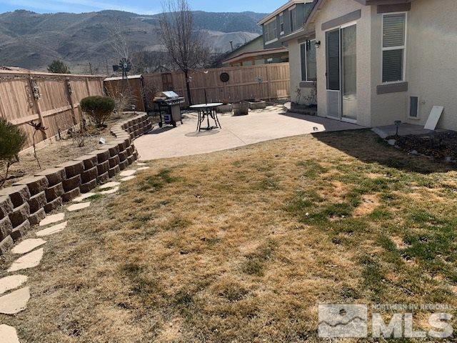 2581 Spring Flower Drive Reno, NV 89521 - Photo 13 of 14 a view of a backyard with sitting area