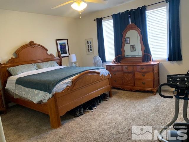 2581 Spring Flower Drive Reno, NV 89521 - Photo 10 of 14 a bedroom with a bed and a dresser