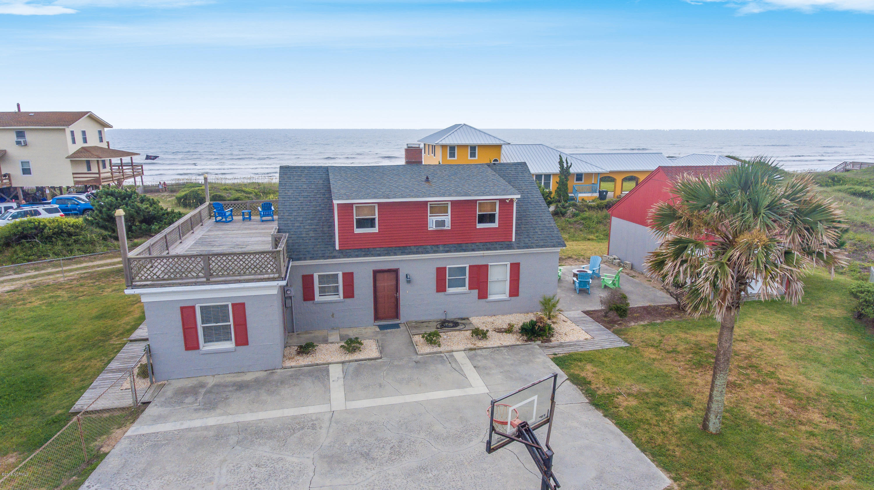 203 Hoffman Beach Road Atlantic Beach, NC 28512 - Photo 3 of 50 Nestled among $1,000,000 + homes, here is your chance to own "SOLITUDE" for much less. Only county taxes; no city taxes! Property extends beyond the wooden fence line. Many possibilities with this .56 acre lot!