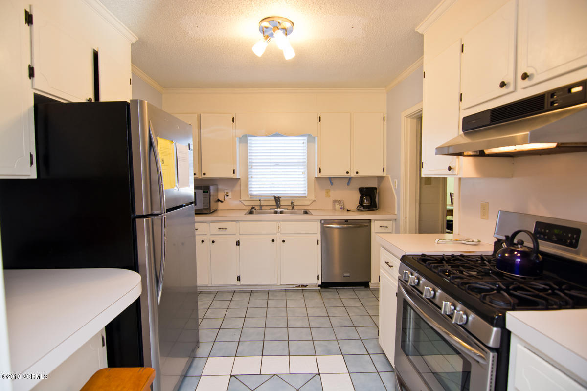 203 Hoffman Beach Road Atlantic Beach, NC 28512 - Photo 6 of 50 Newer stainless appliances, with LP gas cooking and tile floor.