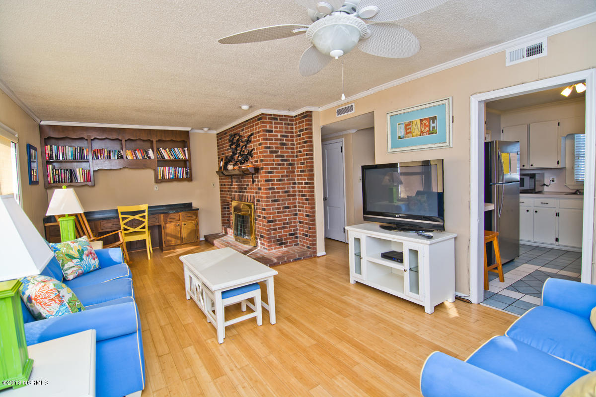 203 Hoffman Beach Road Atlantic Beach, NC 28512 - Photo 8 of 50 Bamboo flooring and LP gas fireplace.