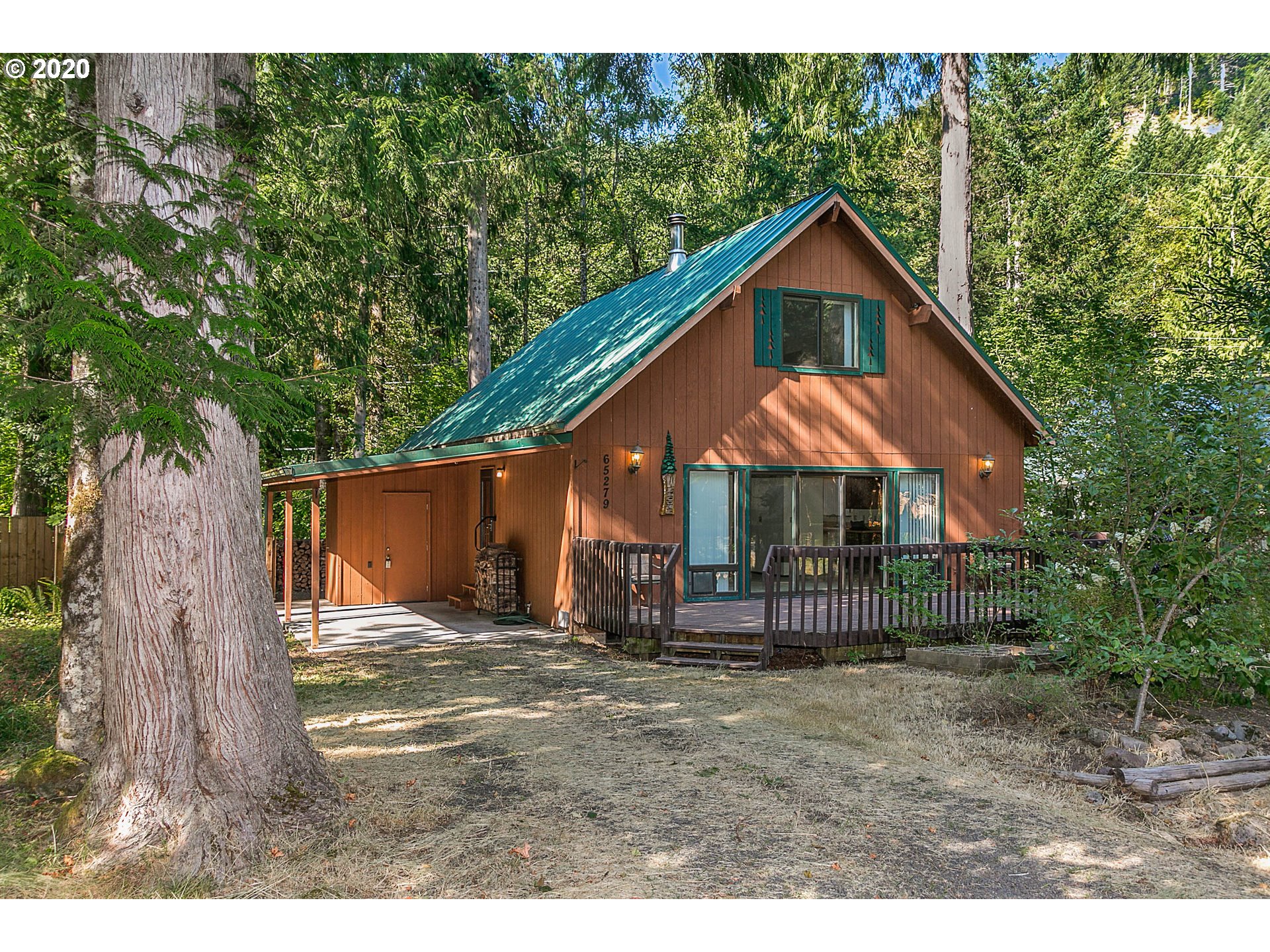 65279 East Timberline Drive Rhododendron, OR 97049 - Photo 1 of 32 a house view with a outdoor space