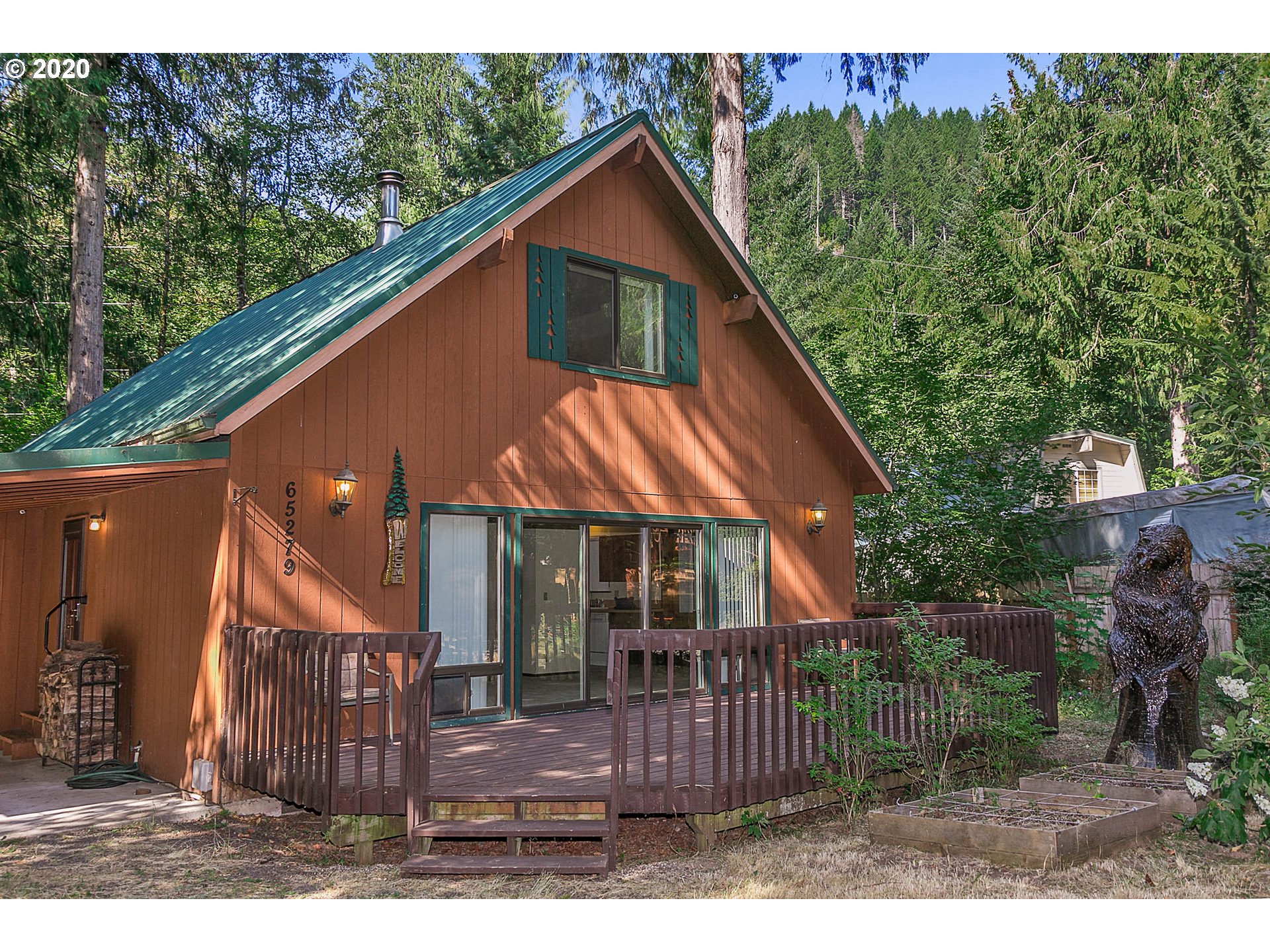 65279 East Timberline Drive Rhododendron, OR 97049 - Photo 3 of 32 a view of house with backyard and outdoor seating