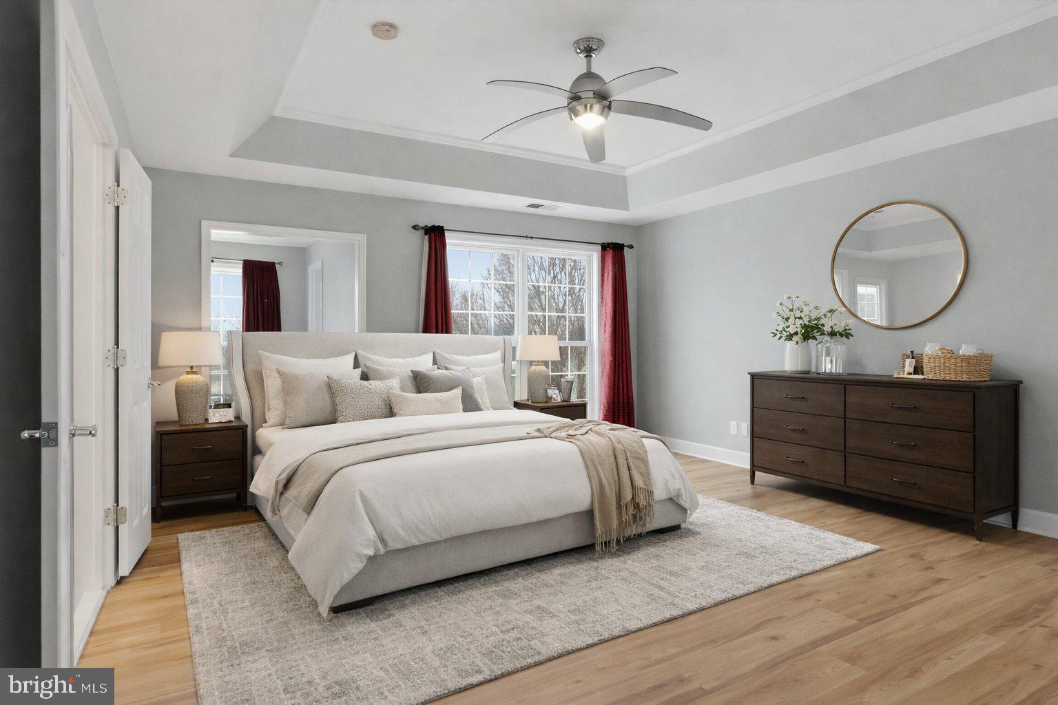 42906 Bittner Square Ashburn, VA 20148 - Photo 12 of 31 a bedroom with a large bed and a chandelier
