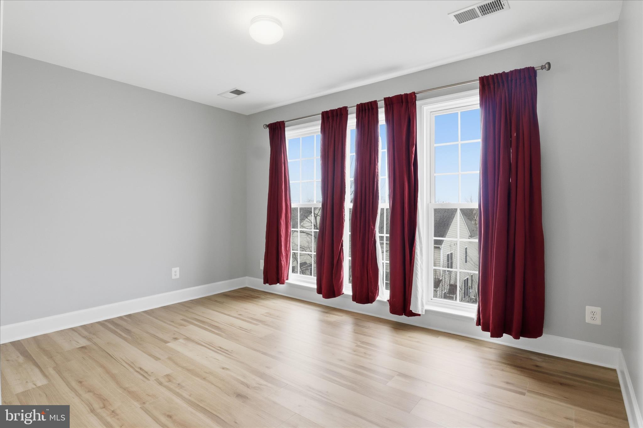 42906 Bittner Square Ashburn, VA 20148 - Photo 13 of 31 an empty room with wooden floor and windows