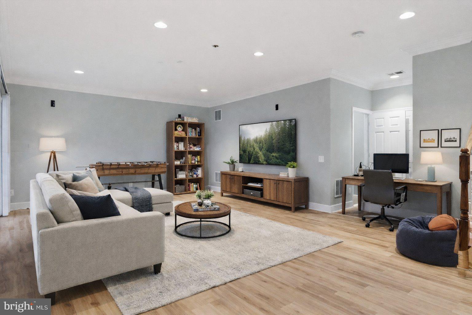 42906 Bittner Square Ashburn, VA 20148 - Photo 20 of 31 a living room with furniture and a flat screen tv