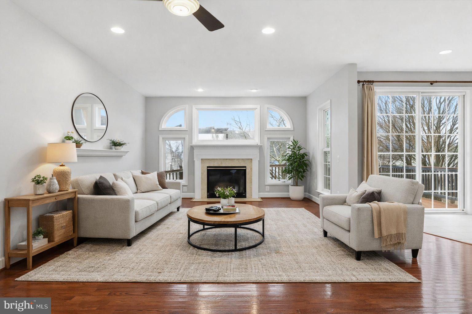 42906 Bittner Square Ashburn, VA 20148 - Photo 6 of 31 a living room with furniture and a fireplace