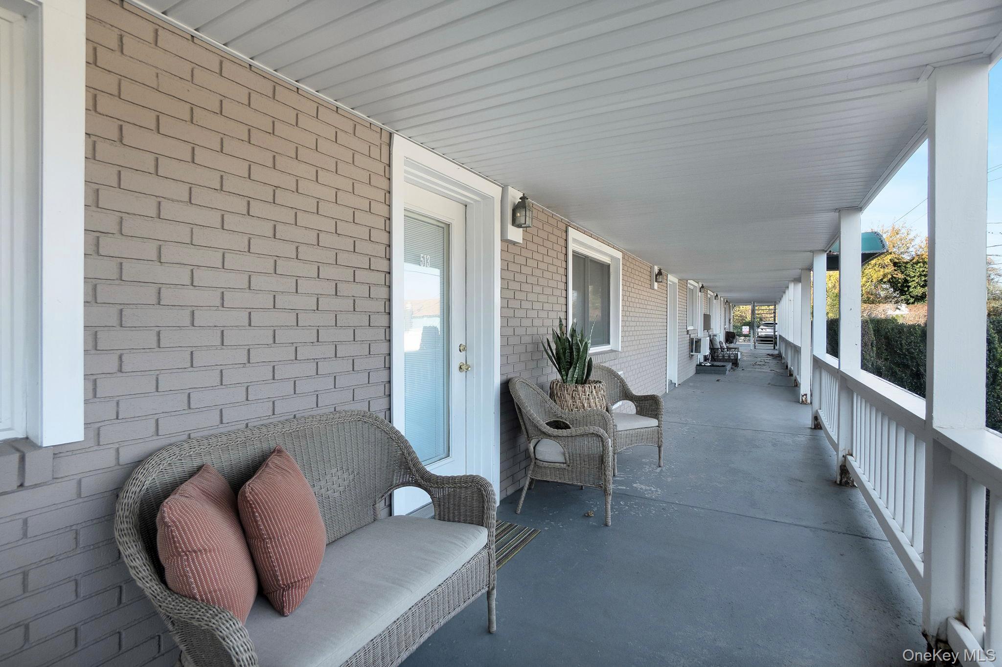 62 Canoe Place Road, Unit 513/5 Hampton Bays, NY 11946 - Photo 3 of 15 View of covered porch