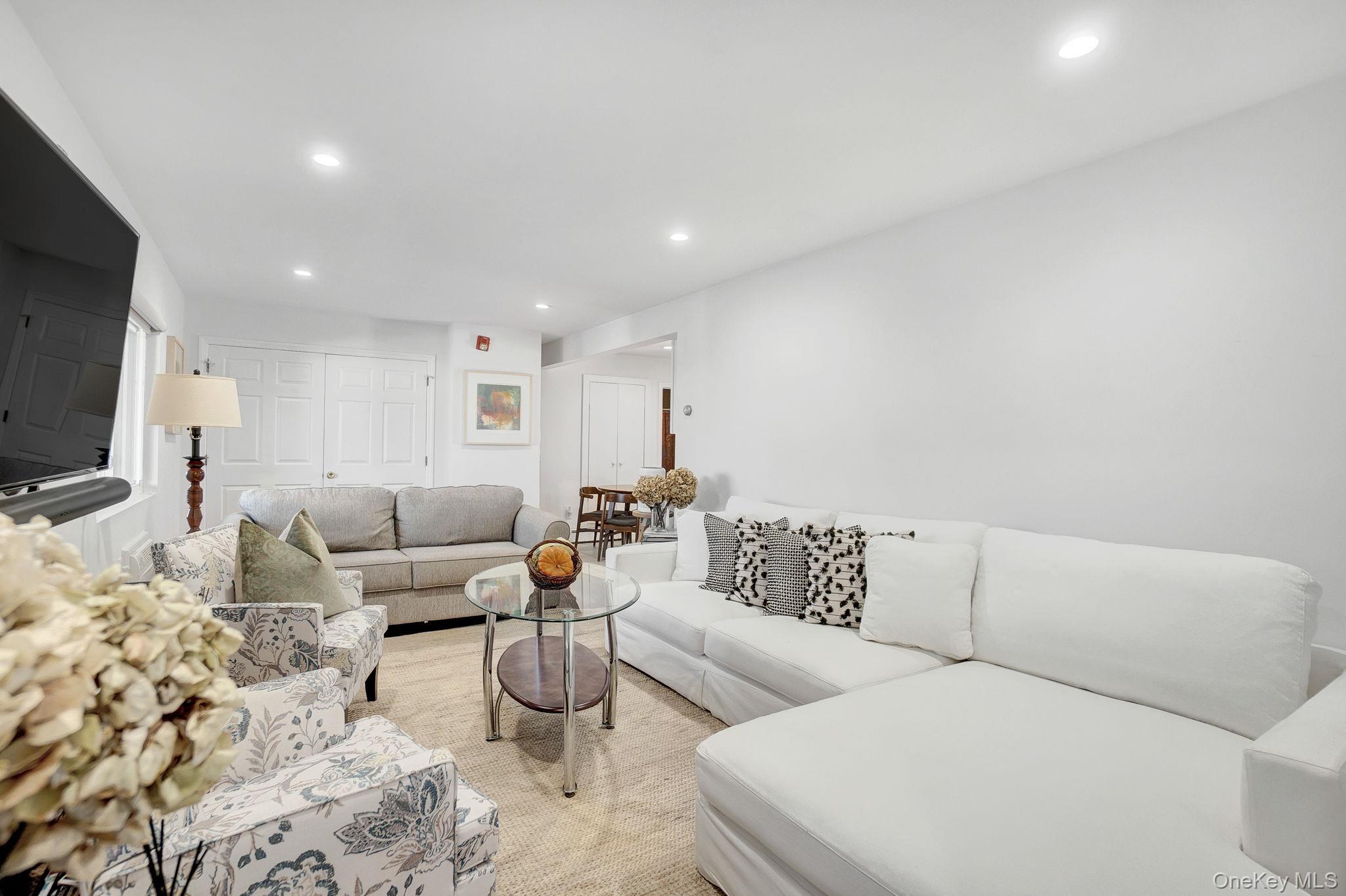 62 Canoe Place Road, Unit 513/5 Hampton Bays, NY 11946 - Photo 4 of 15 Living area with recessed lighting