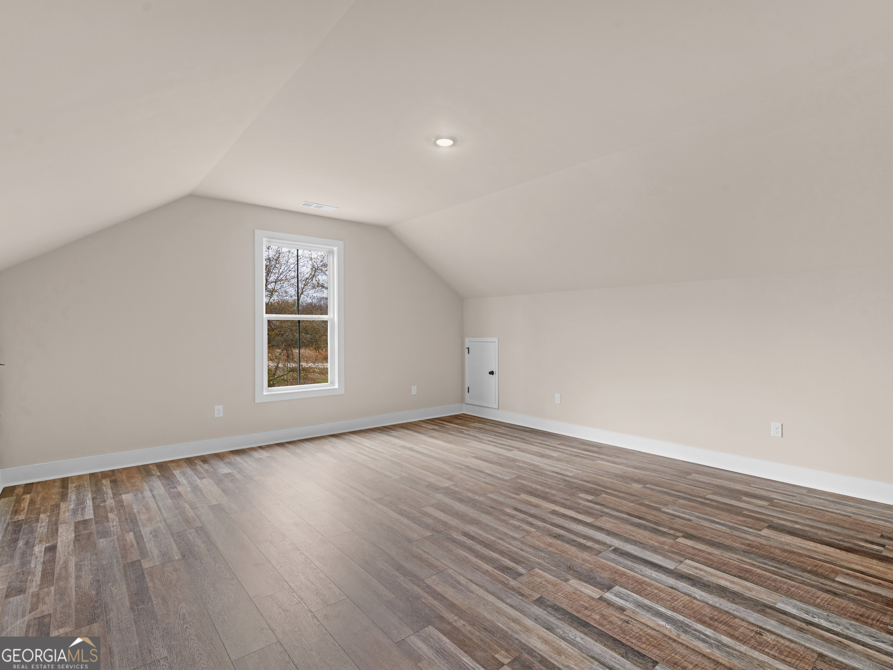 160 Loyd Road Mansfield, GA 30056 - Photo 52 of 53 a view of an empty room with wooden floor and a window