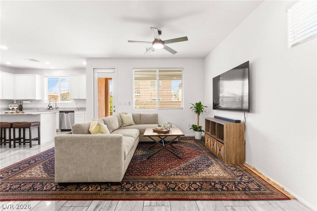 6435 Point Isabel Way Las Vegas, NV 89122 - Photo 7 of 57 An open-concept living area provides a bright, connected space for gathering and entertaining.