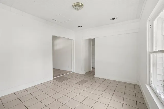 a view of an empty room and window