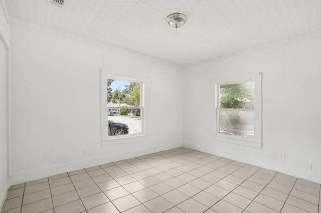 an empty room with windows