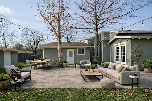 a view of a hallway with wooden floor and a kitchen view