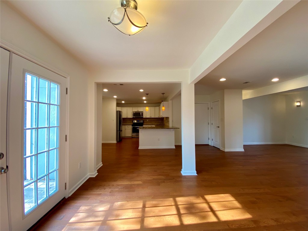2003 Patton Lane Austin, TX 78723 - Photo 10 of 38 Unfurnished living room with light wood floors and recessed lighting