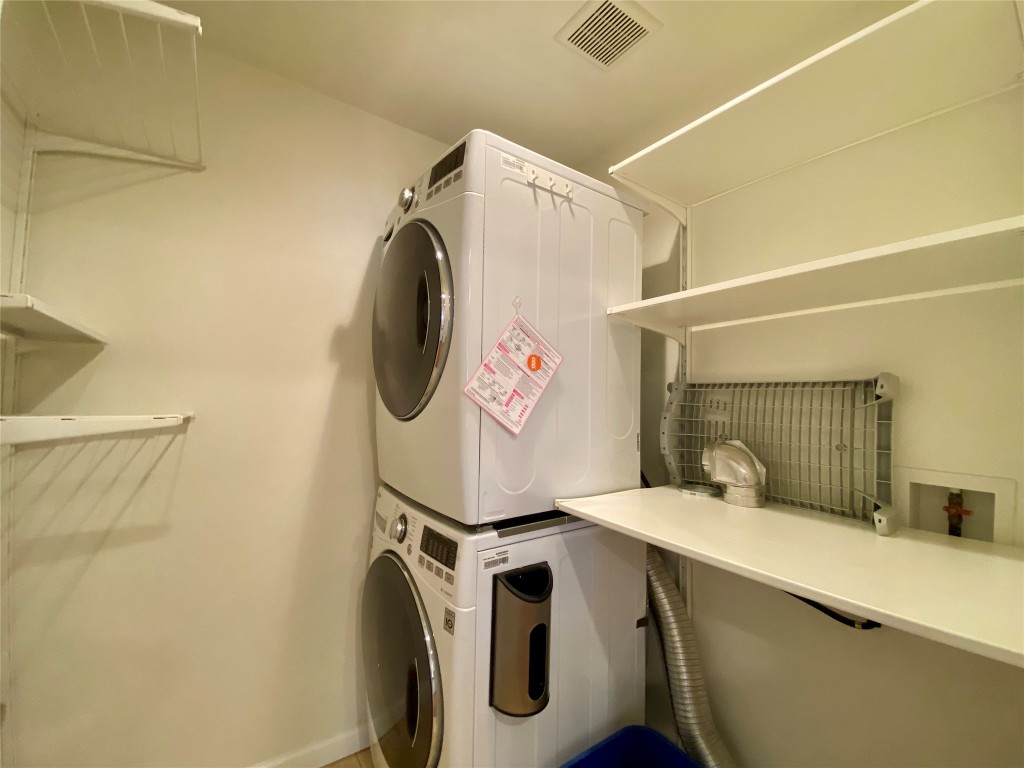 2003 Patton Lane Austin, TX 78723 - Photo 20 of 38 Washroom with stacked washer / dryer