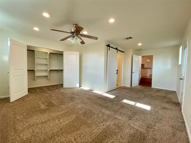 a bathroom with a granite countertop sink mirror and shower