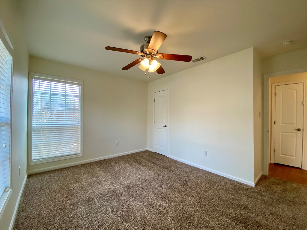 2003 Patton Lane Austin, TX 78723 - Photo 24 of 38 Guest Bedroom 2 featuring baseboards and a ceiling fan