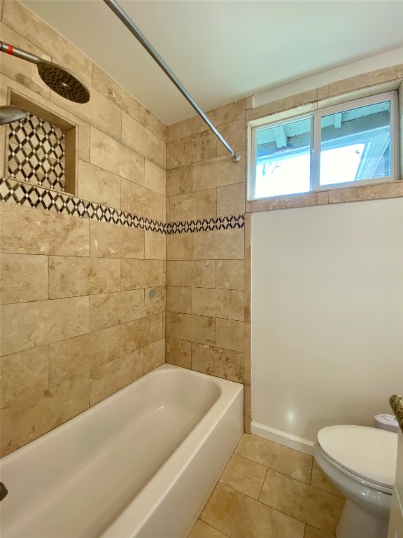 2003 Patton Lane Austin, TX 78723 - Photo 25 of 38 Full guest bath with tile patterned flooring and bathing tub / shower combination