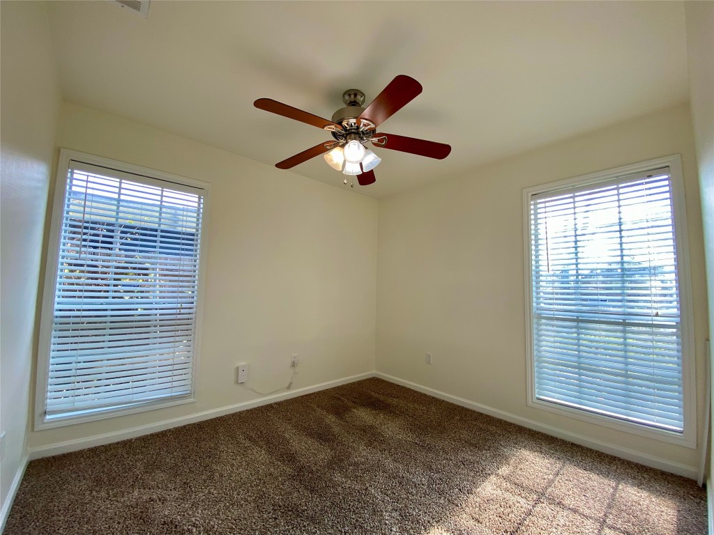 2003 Patton Lane Austin, TX 78723 - Photo 27 of 38 Guest Bedroom 3 featuring healthy amount of natural light and a ceiling fan