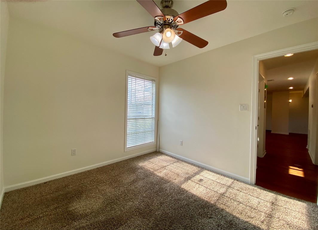 2003 Patton Lane Austin, TX 78723 - Photo 28 of 38 Guest Bedroom 3 with carpet floors and ceiling fan