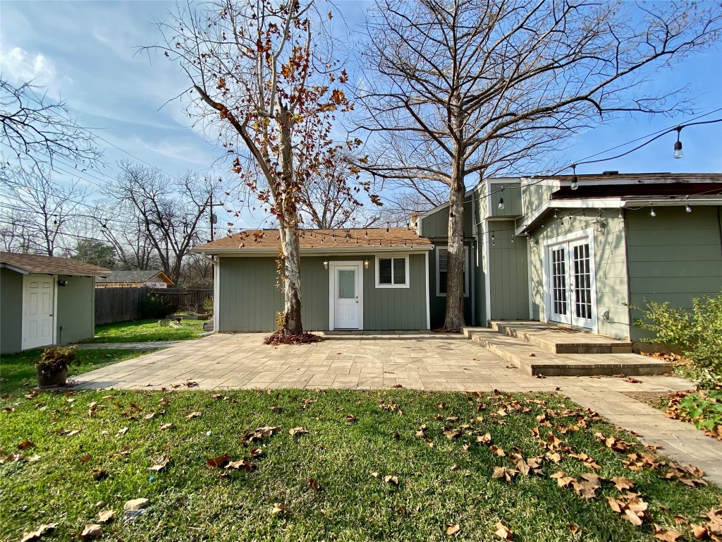 2003 Patton Lane Austin, TX 78723 - Photo 33 of 38 Back of property with french doors, a patio, and an shed