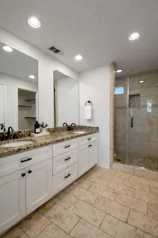 a view of house with outdoor space and a car parking space