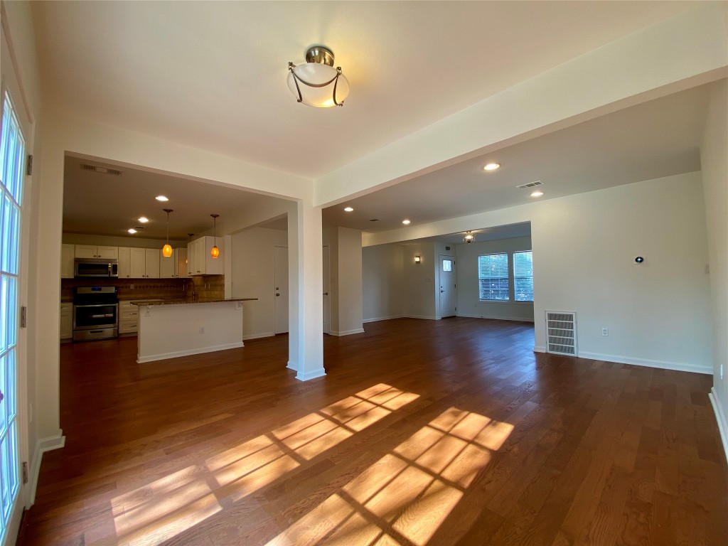 2003 Patton Lane Austin, TX 78723 - Photo 5 of 38 Dining area or Living room featuring recessed lighting and light wood floors