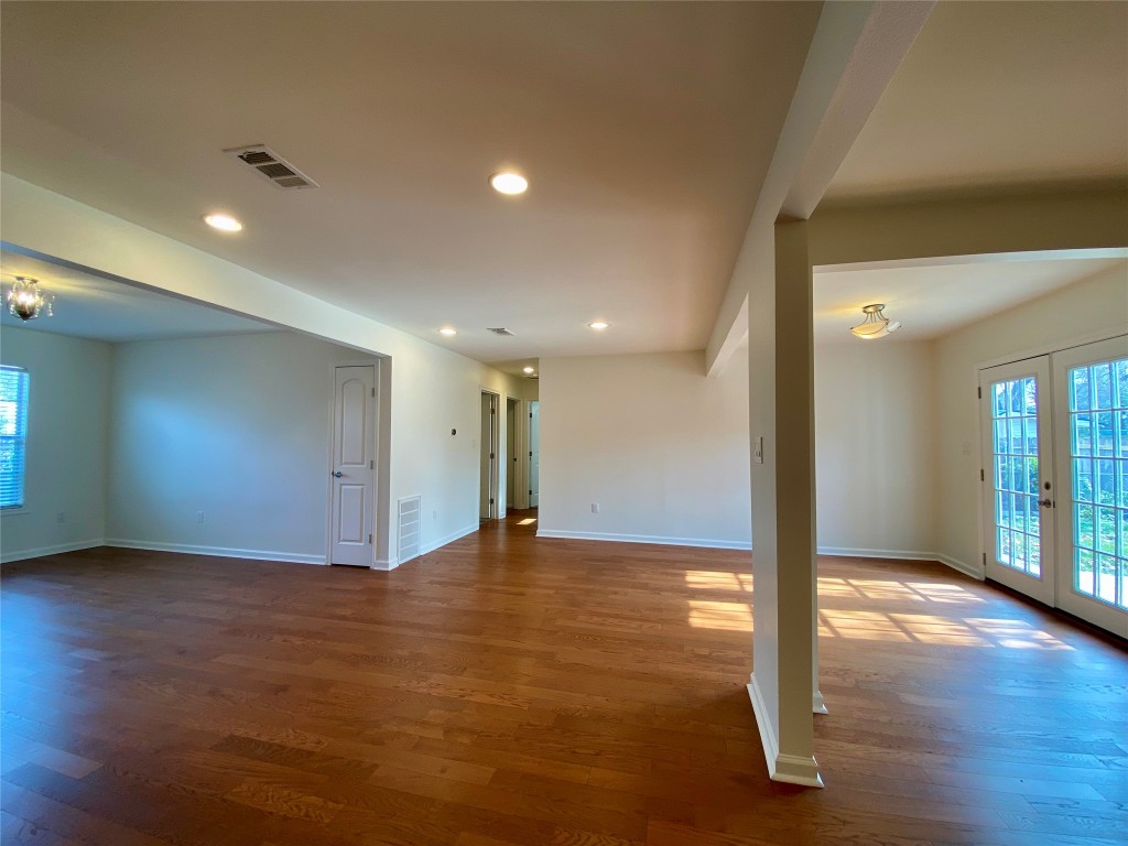 2003 Patton Lane Austin, TX 78723 - Photo 7 of 38 Living room with french doors, light wood floors, and recessed lighting