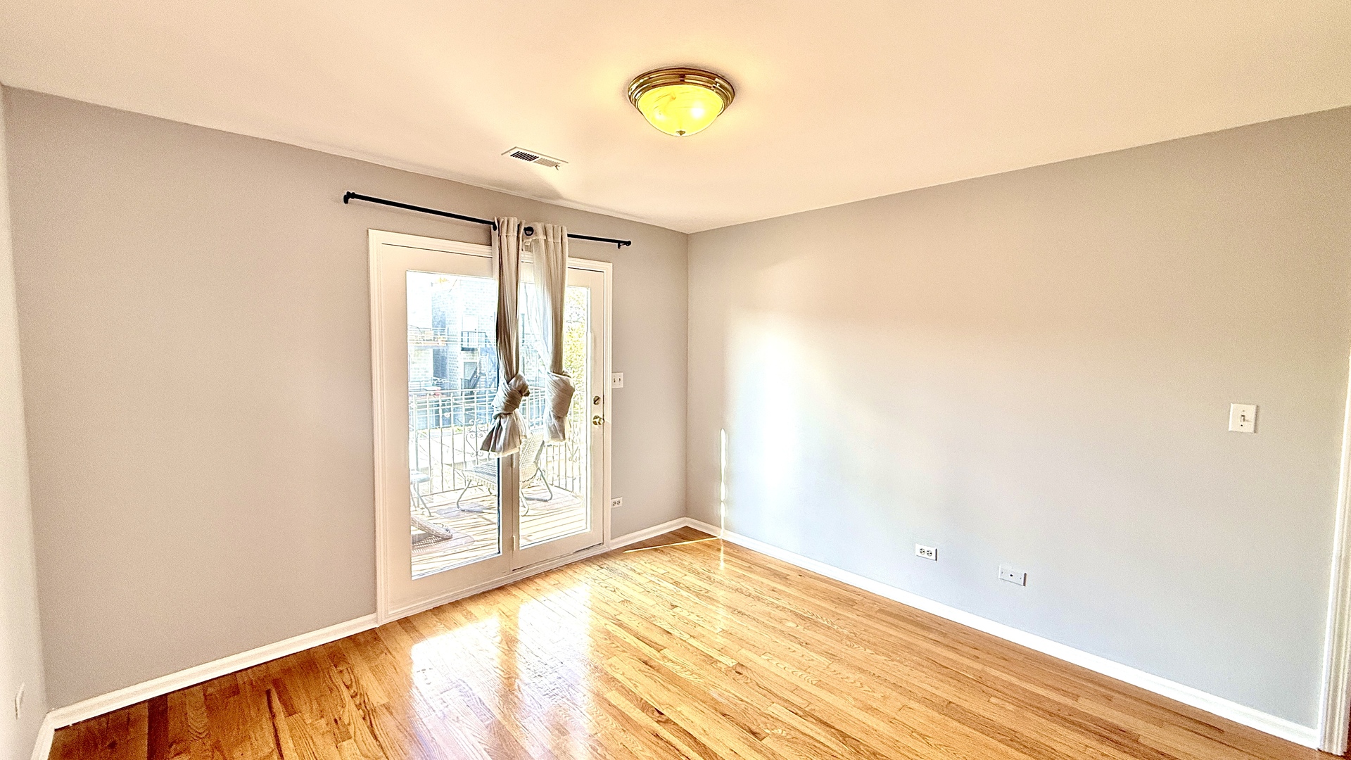 1078 North Hermitage Avenue, Unit 3 Chicago, IL 60622 - Photo 11 of 17 a view of a room with wooden floor and window