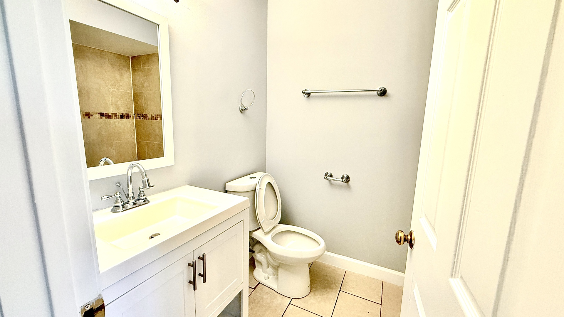 1078 North Hermitage Avenue, Unit 3 Chicago, IL 60622 - Photo 12 of 17 a bathroom with a sink mirror vanity and toilet