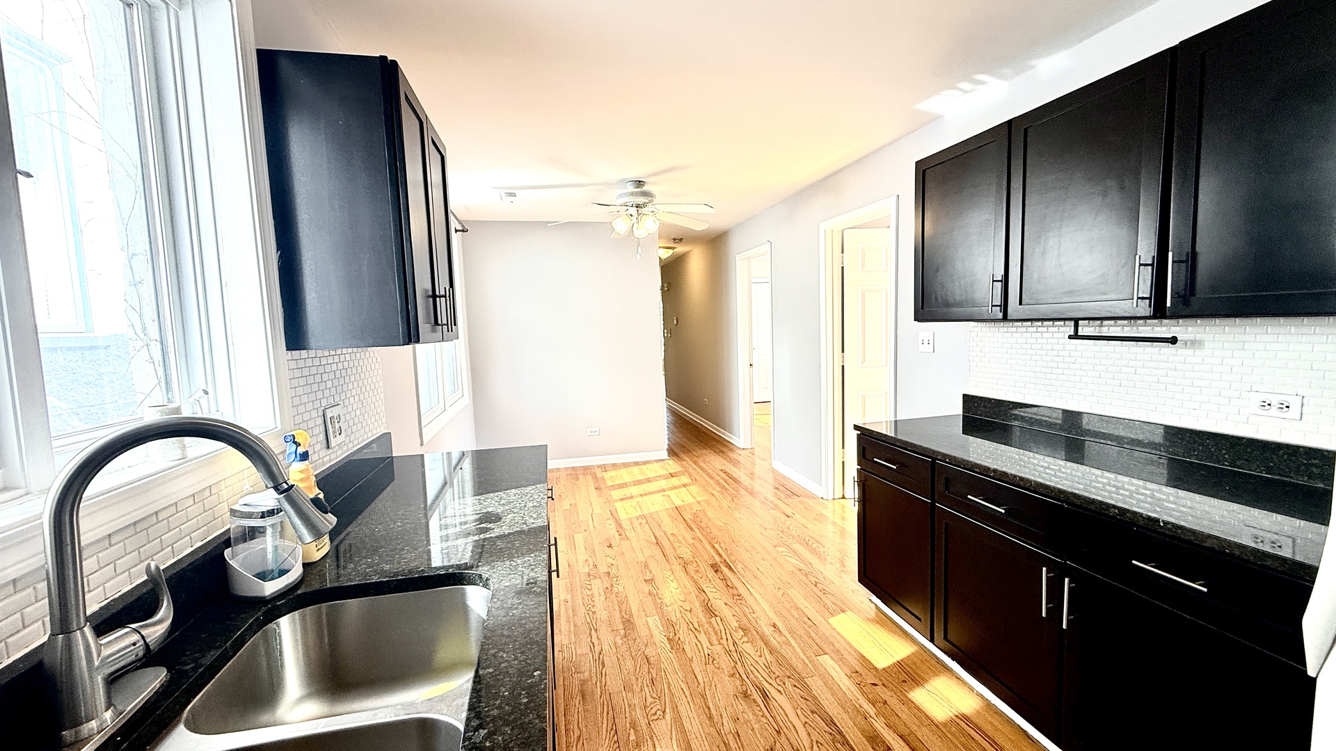 1078 North Hermitage Avenue, Unit 3 Chicago, IL 60622 - Photo 17 of 17 a kitchen with a sink and a refrigerator