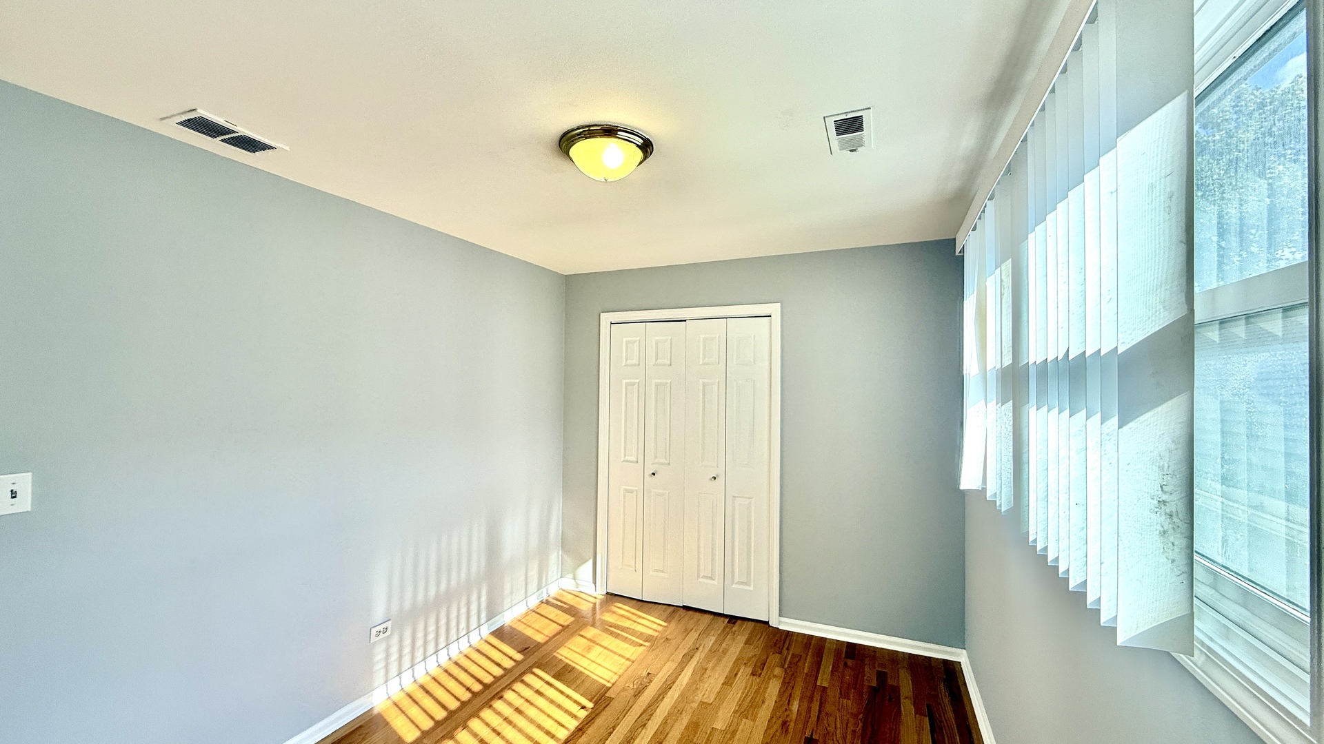 1078 North Hermitage Avenue, Unit 3 Chicago, IL 60622 - Photo 6 of 17 a view of a livingroom with wooden floor and a window