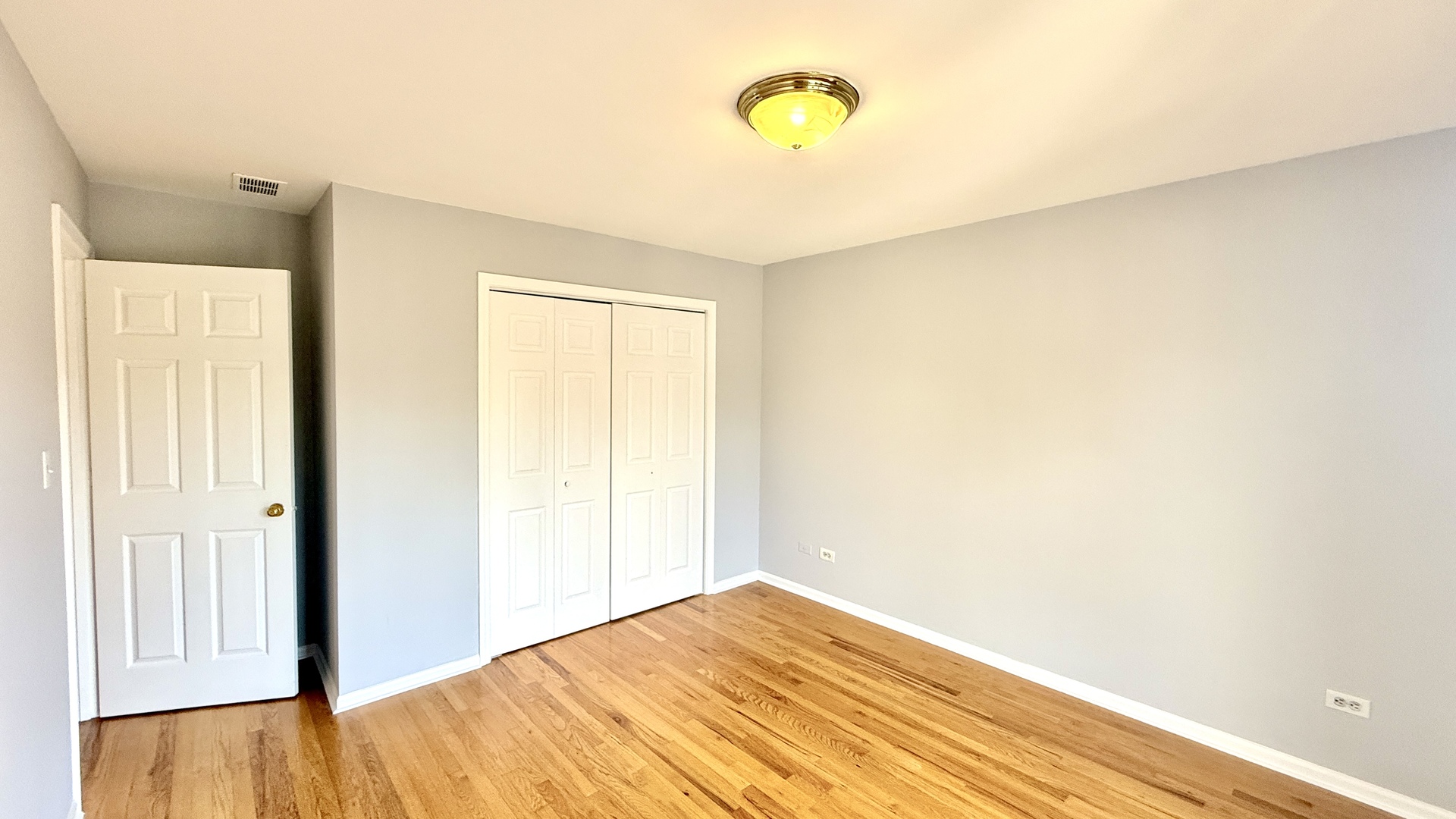 1078 North Hermitage Avenue, Unit 3 Chicago, IL 60622 - Photo 9 of 17 a view of a room with wooden floor and window