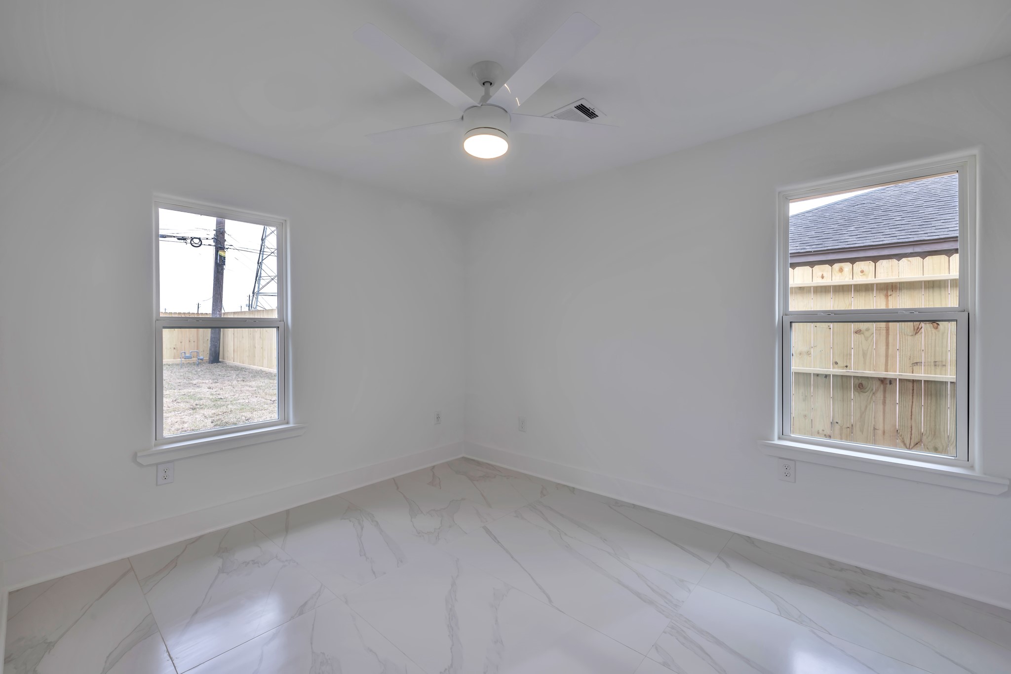8709 Tarbell Road Houston, TX 77034 - Photo 13 of 25 an empty room with a window