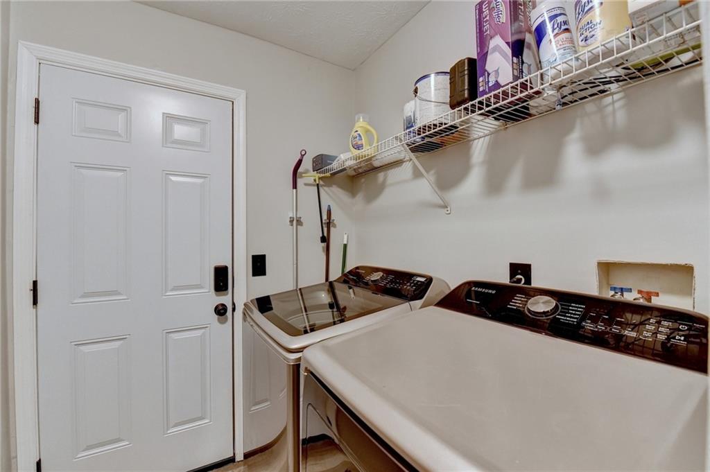 801 Davis Street Monroe, GA 30655 - Photo 22 of 33 a close view of a sink a stove and refrigerator