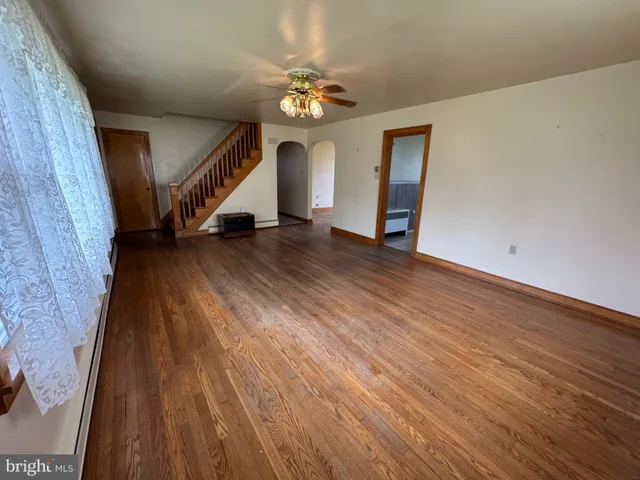 a view of an entryway with wooden floor