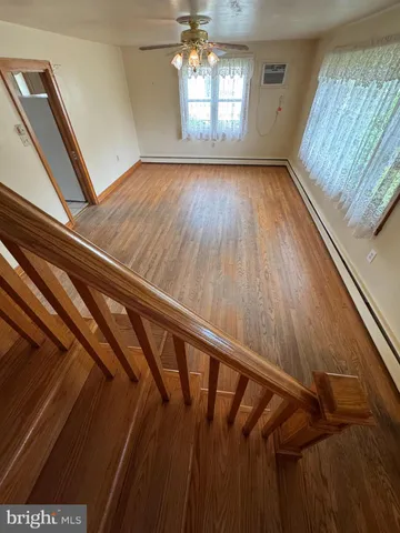 a view of entryway with wooden floor