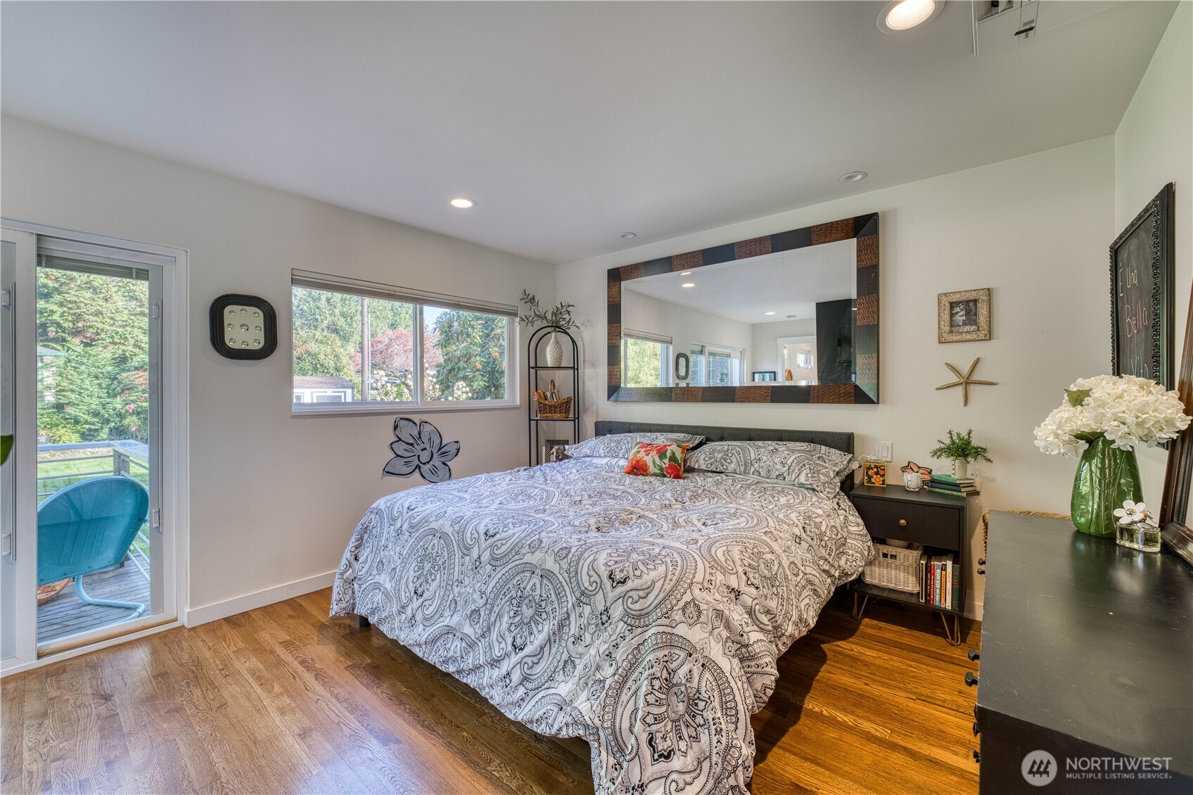 10536 Northeast 189th Street Bothell, WA 98011 - Photo 12 of 37 a bed sitting in a bedroom next to a window