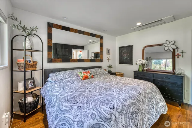 a bedroom with bed and window