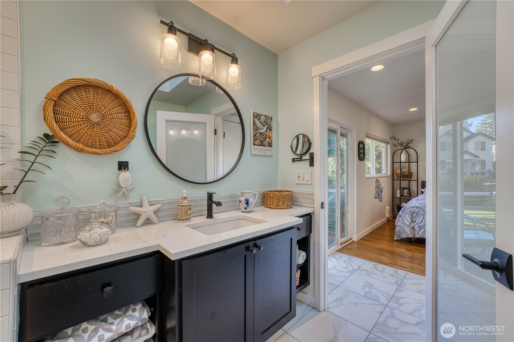 10536 Northeast 189th Street Bothell, WA 98011 - Photo 16 of 37 a en suite bathroom with a sink and a mirror