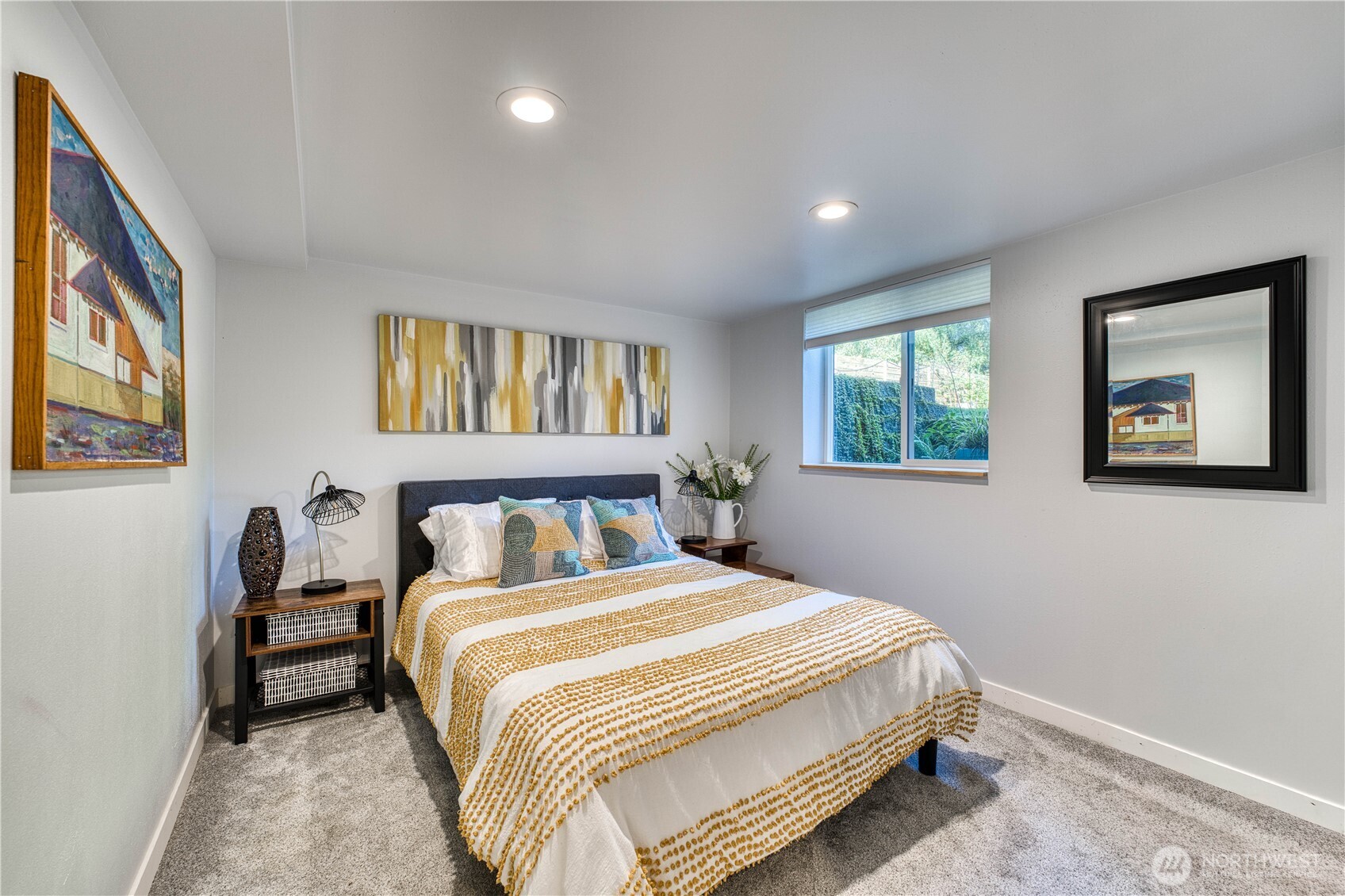 10536 Northeast 189th Street Bothell, WA 98011 - Photo 22 of 37 a bedroom with a bed and a painting on the wall