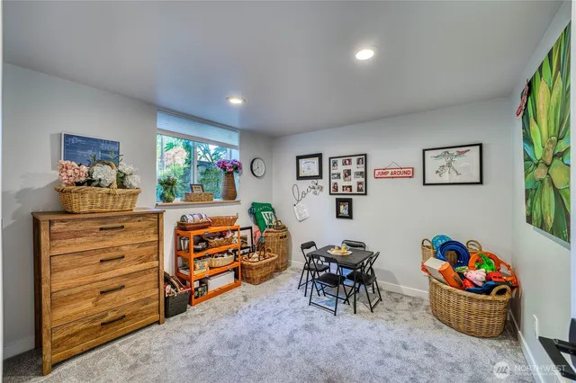a bedroom with furniture a baby crib and a window