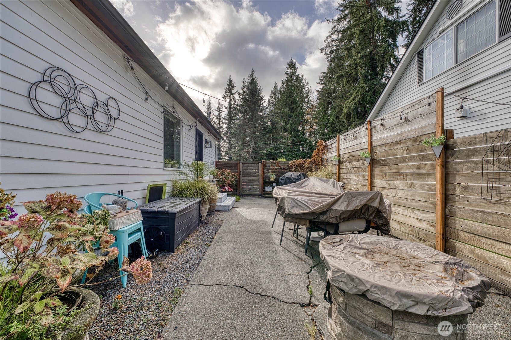10536 Northeast 189th Street Bothell, WA 98011 - Photo 28 of 37 a backyard of a house with table and chairs