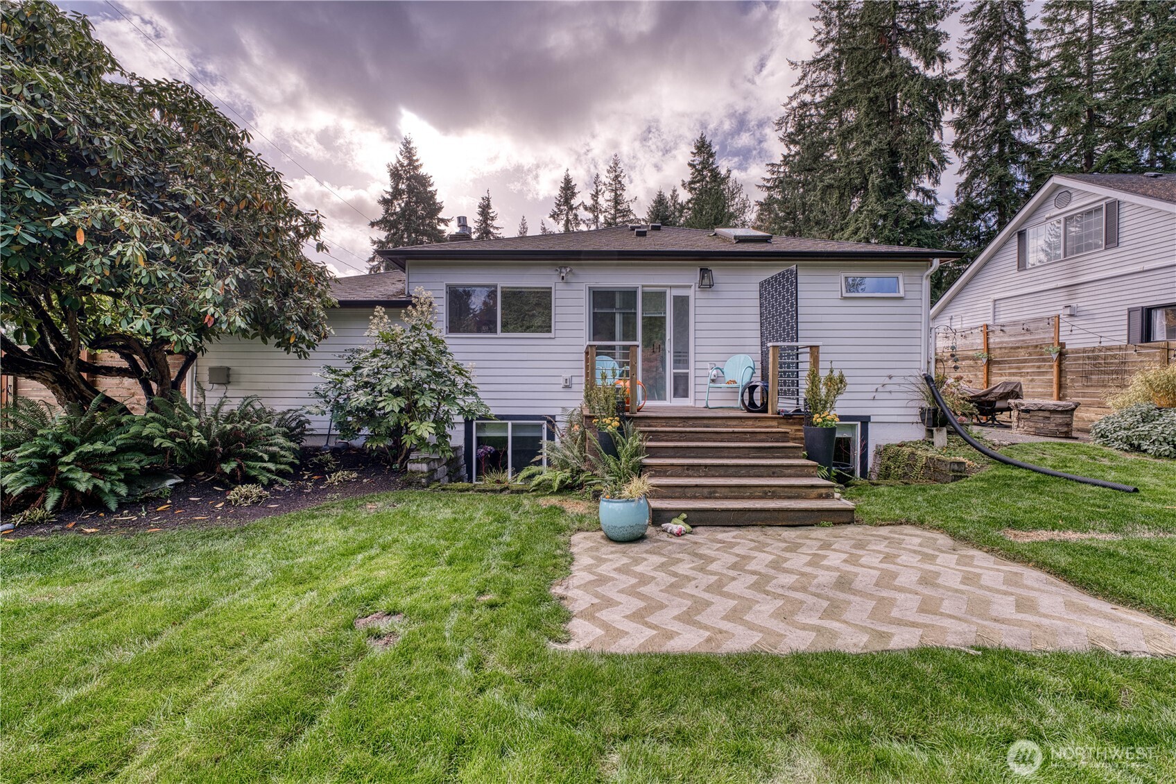10536 Northeast 189th Street Bothell, WA 98011 - Photo 30 of 37 a front view of a house with garden