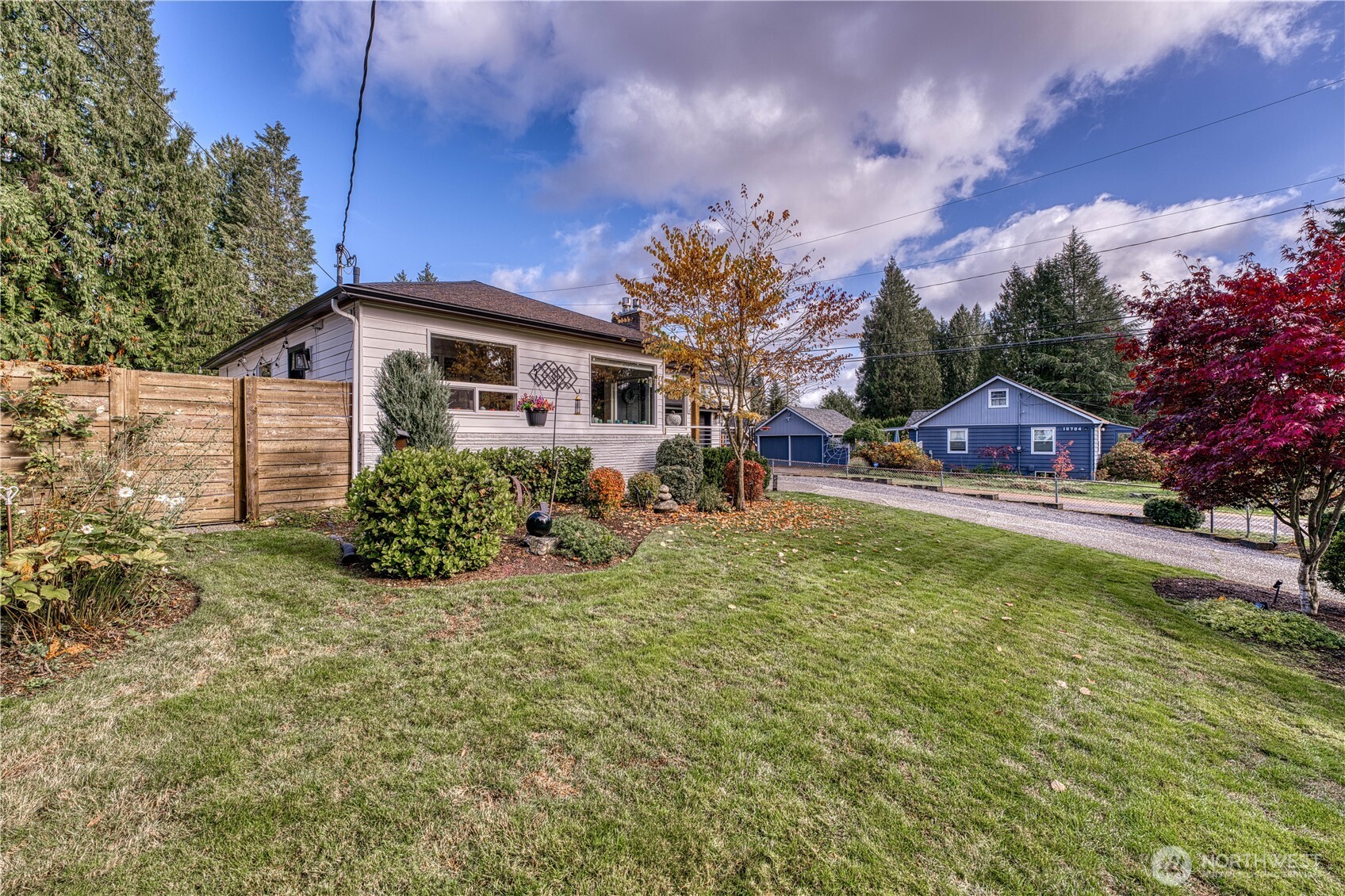 10536 Northeast 189th Street Bothell, WA 98011 - Photo 3 of 37 a view of a house with a yard and potted plants