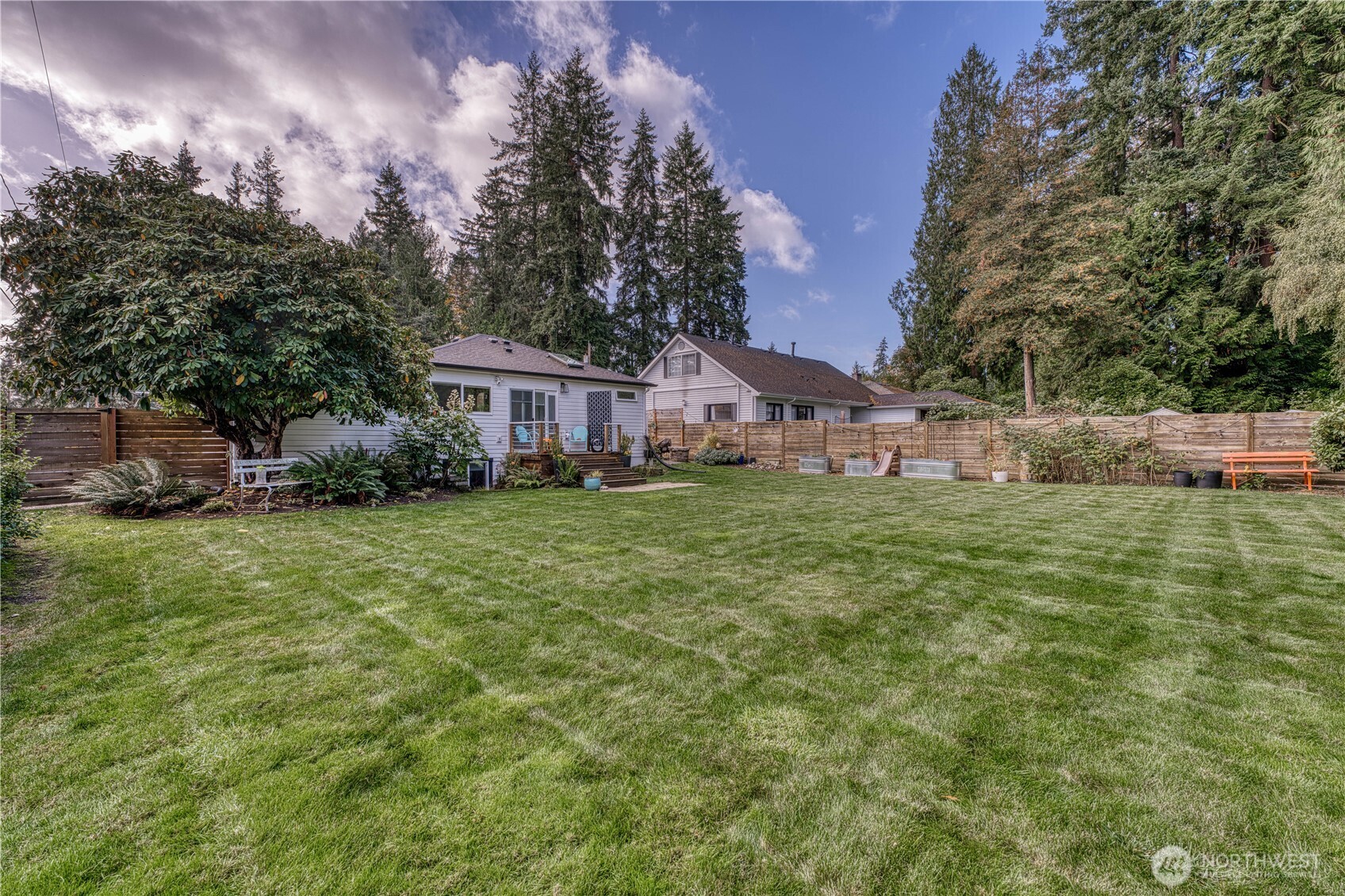 10536 Northeast 189th Street Bothell, WA 98011 - Photo 34 of 37 a view of a house with a yard and sitting area